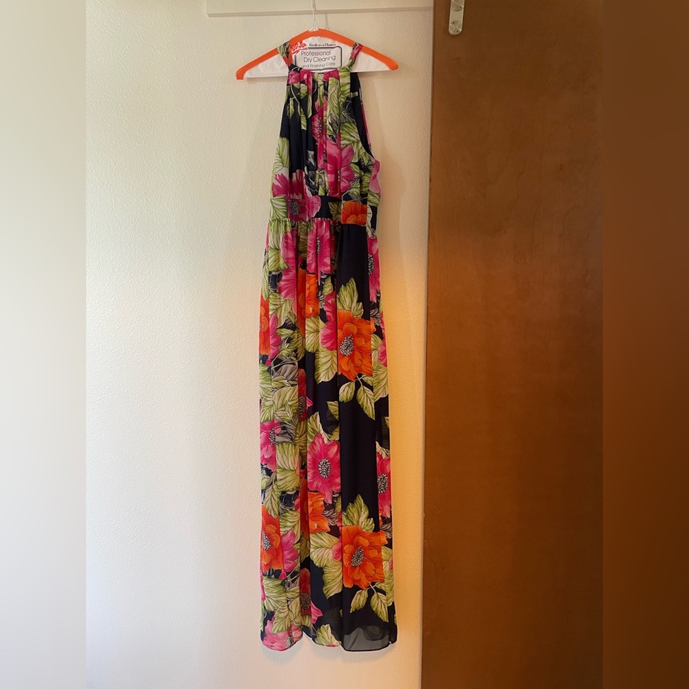 Floor length floral  halter dress with back zip and tie at neck.